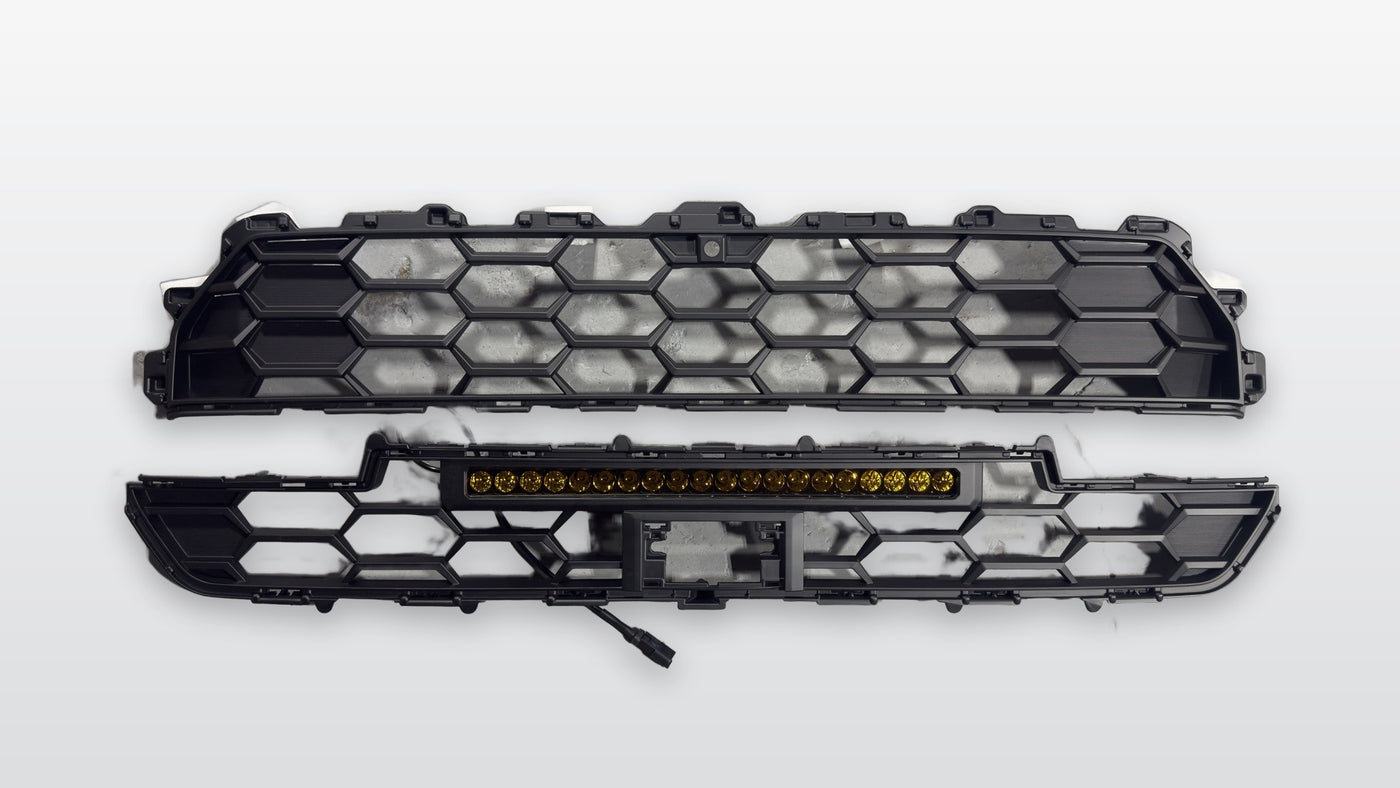 2025+ 4Runner Apex Pro grille two-piece set with amber LED light bar on studio background